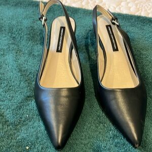 Black sling back one inch pumps
